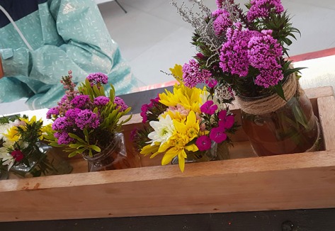 Bright bunches of wild flowers on display in the eating area of the Willowbridge market.